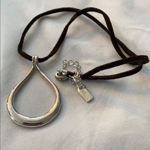 Liz & Co necklace with brown leather neck strap.